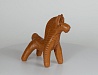 Конь-игрушка. Конь с большой гривой, из красной глины, украшен насечками. М.: глина; Т.: лепка, обжиг. Высота - 11,5 см.