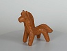Конь-игрушка. Конь с большой гривой, из красной глины, украшен насечками. М.: глина; Т.: лепка, обжиг. Высота - 11,5 см.